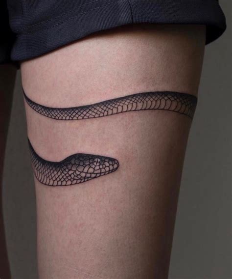 snake wrapped around leg tattoo meaning|Snake Tattoo Meaning